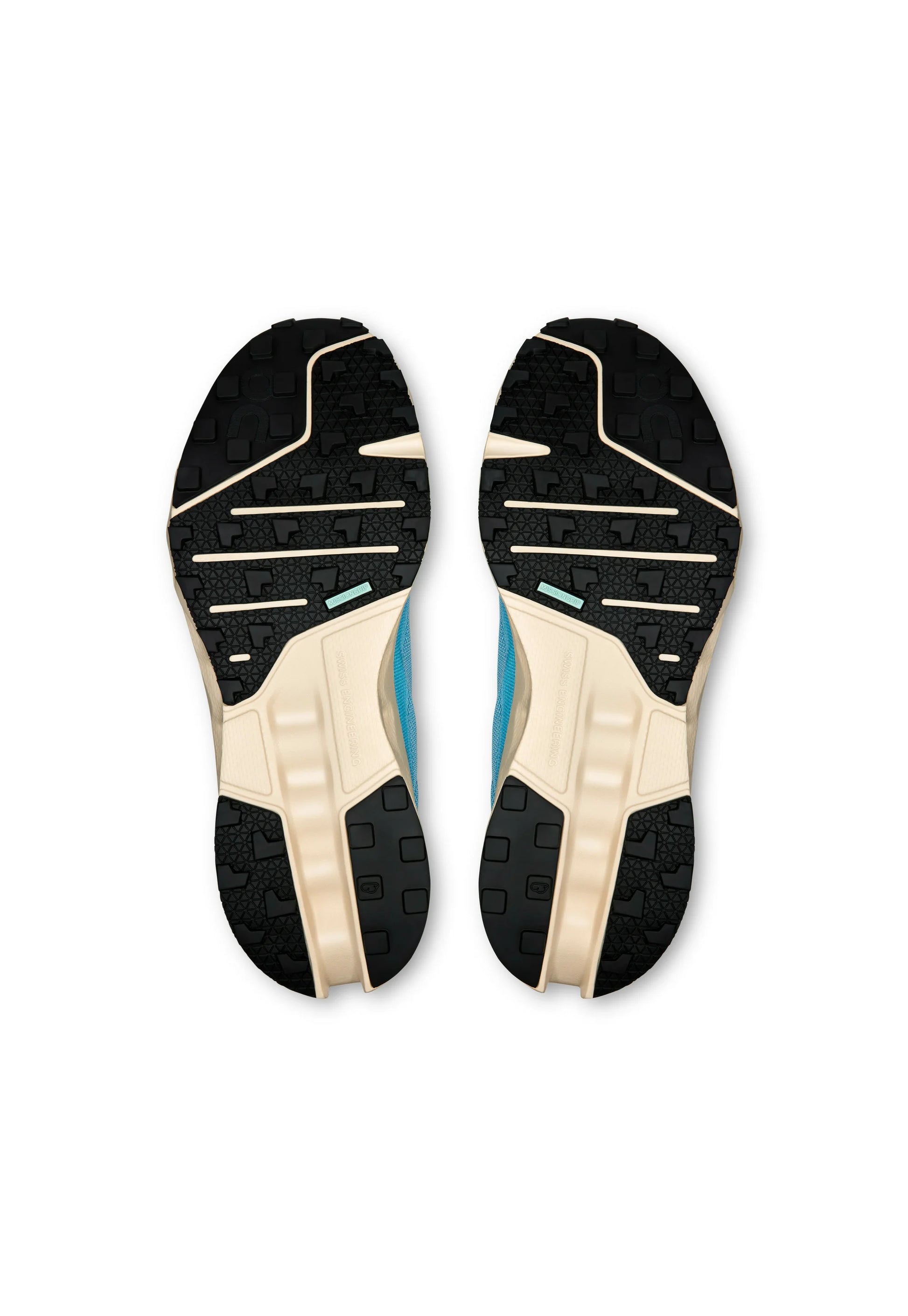 Scarpe da corsa con suole esterne in gomma nera, caratterizzate da un motivo di presa testurizzato. Intersuola color beige chiaro e tomaia in tessuto blu con accenti rinforzati.