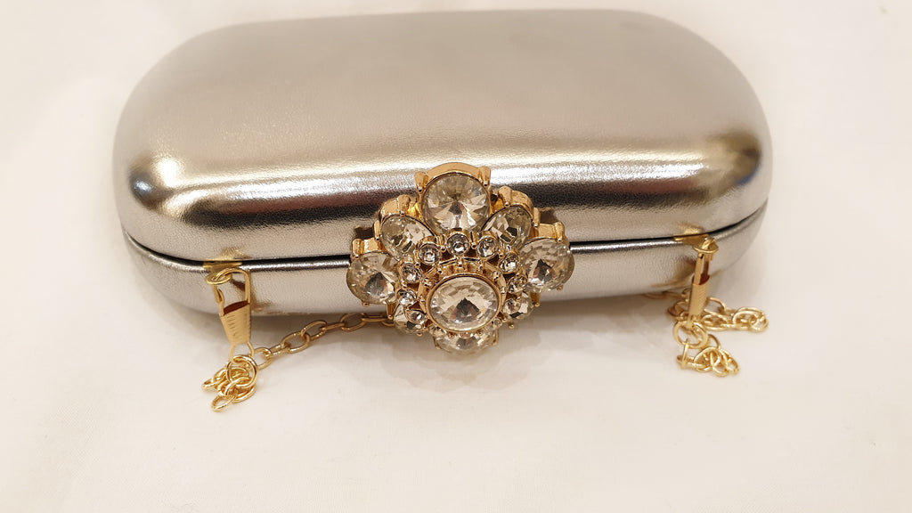 RAKEL: Pochette Rigida oro O argento