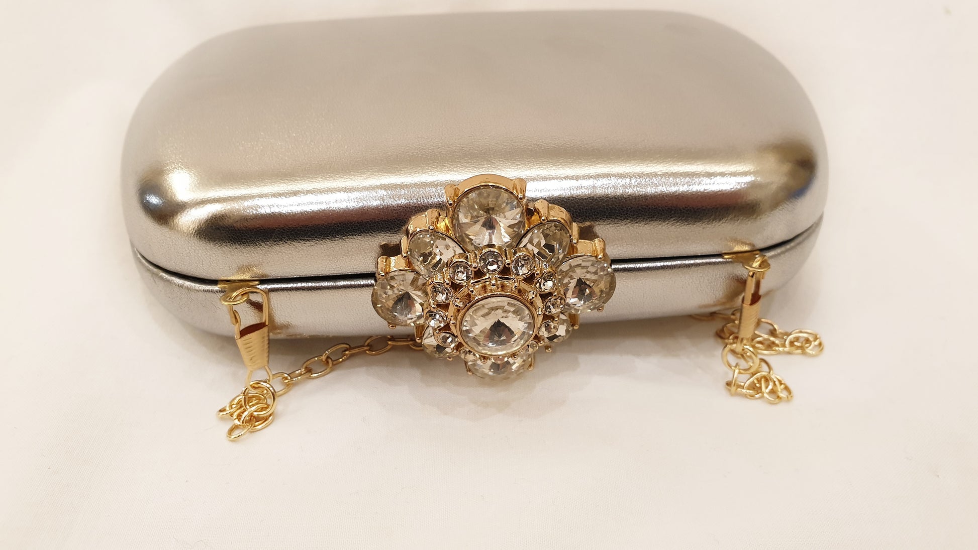 RAKEL: Pochette Rigida oro O argento